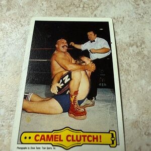 Topps Camel Clutch Wrestling Card - Red and Yellow